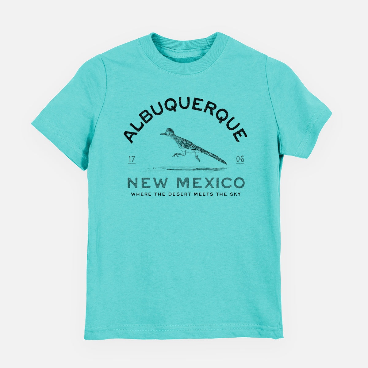 Caribbean blue youth t-shirt laid flat, printed with a black ink roadrunner with the words Albuquerque New Mexico, 1706, Where the Desert Meets the Sky.