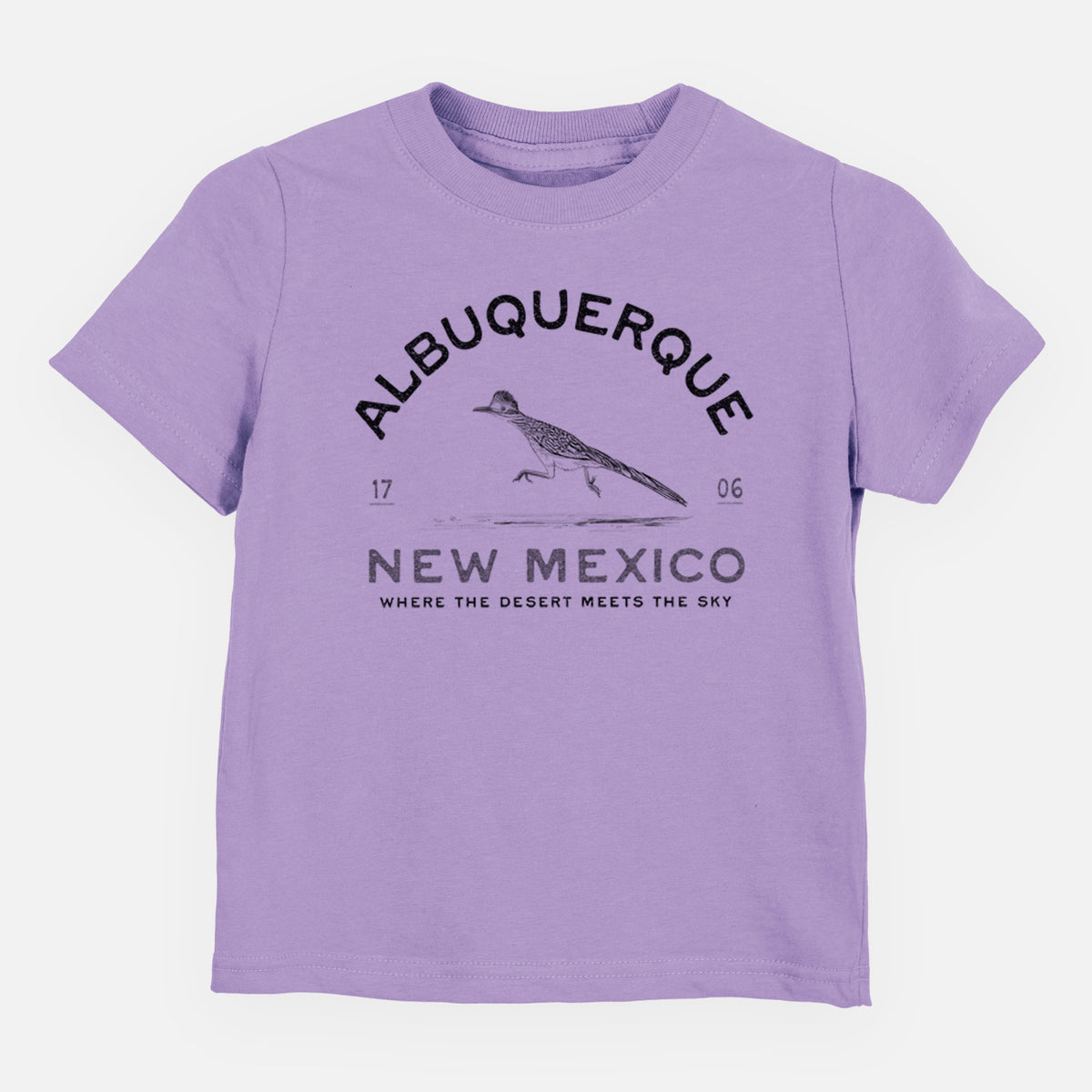 Lavender toddler t-shirt laid flat, printed with a black ink roadrunner with the words Albuquerque New Mexico, 1706, Where the Desert Meets the Sky.