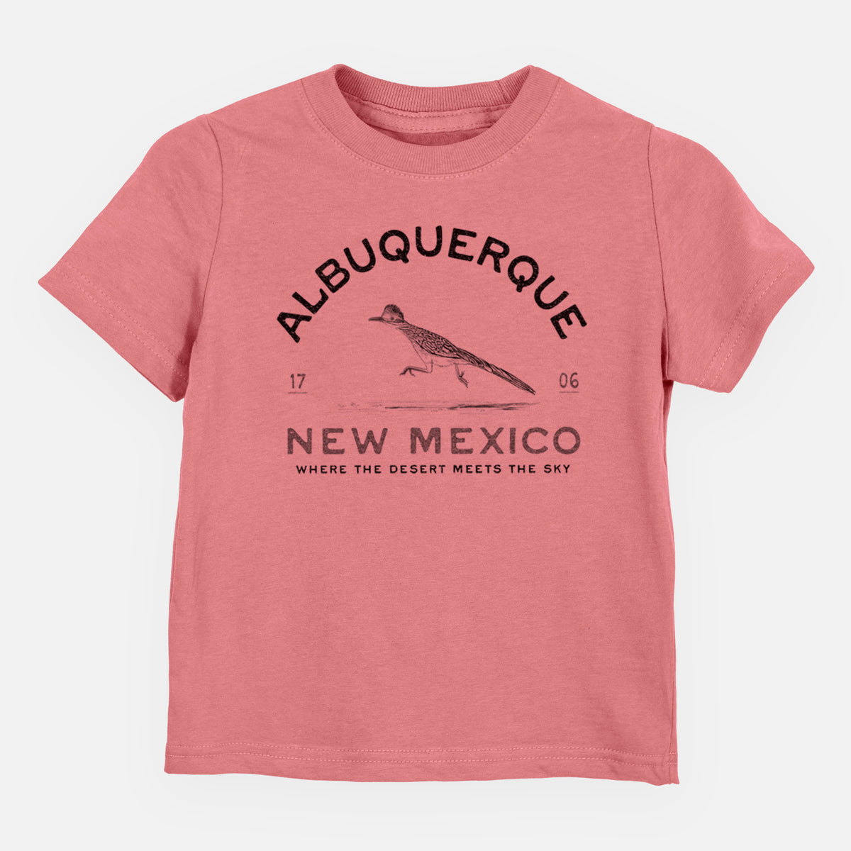 Mauve pink toddler t-shirt laid flat, printed with a black ink roadrunner with the words Albuquerque New Mexico, 1706, Where the Desert Meets the Sky.