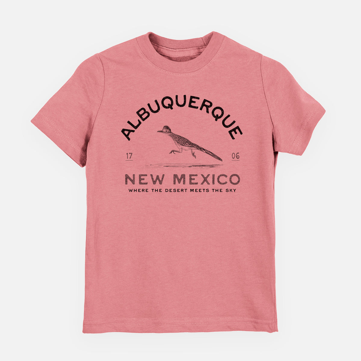 Mauve pink youth t-shirt laid flat, printed with a black ink roadrunner with the words Albuquerque New Mexico, 1706, Where the Desert Meets the Sky.