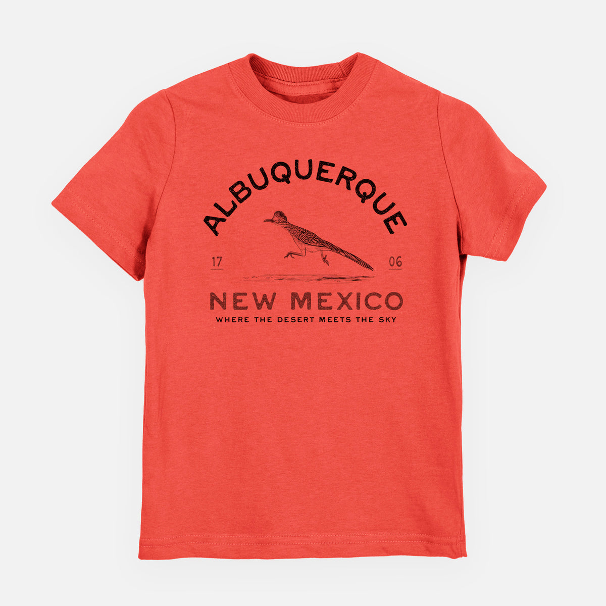 Passionfruit pink youth t-shirt laid flat, printed with a black ink roadrunner with the words Albuquerque New Mexico, 1706, Where the Desert Meets the Sky.