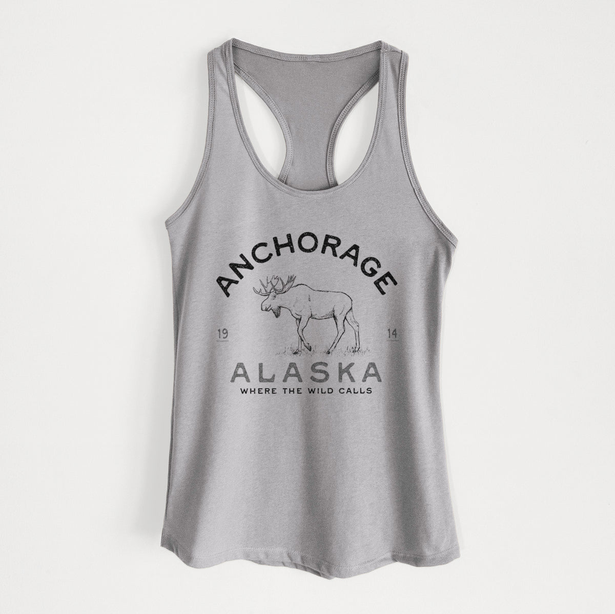 Heather grey women's racerback tank top laid flat, printed with a black ink moose with the words Anchorage Alaska, 1914, Where the Wild Calls.