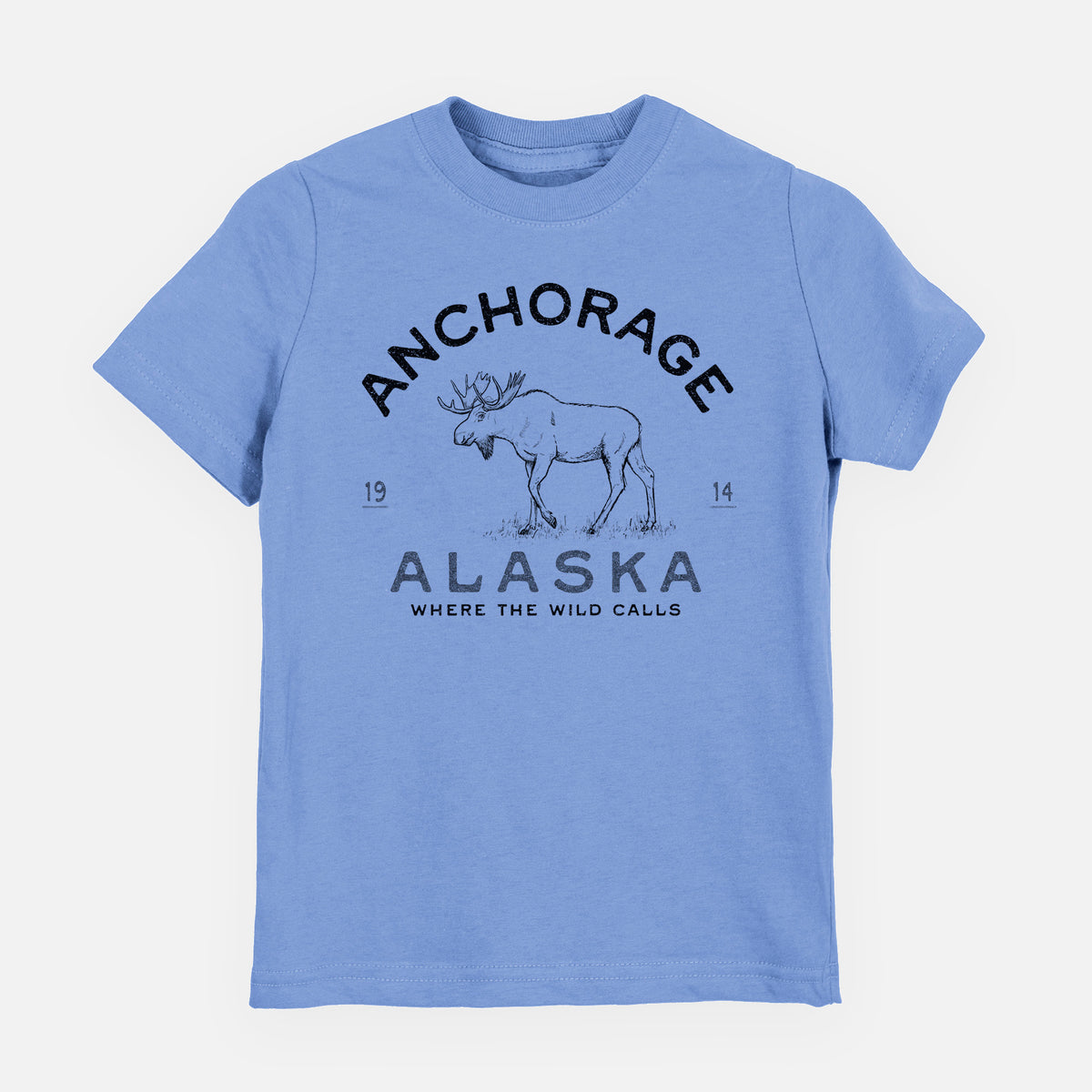 Carolina blue youth t-shirt laid flat, printed with a black ink moose with the words Anchorage Alaska, 1914, Where the Wild Calls.