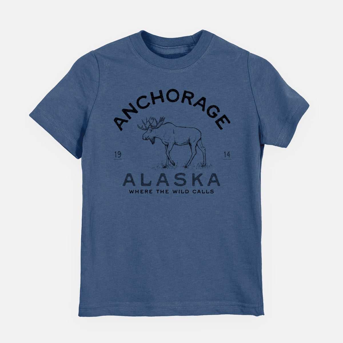 Indigo blue youth t-shirt laid flat, printed with a black ink moose with the words Anchorage Alaska, 1914, Where the Wild Calls.