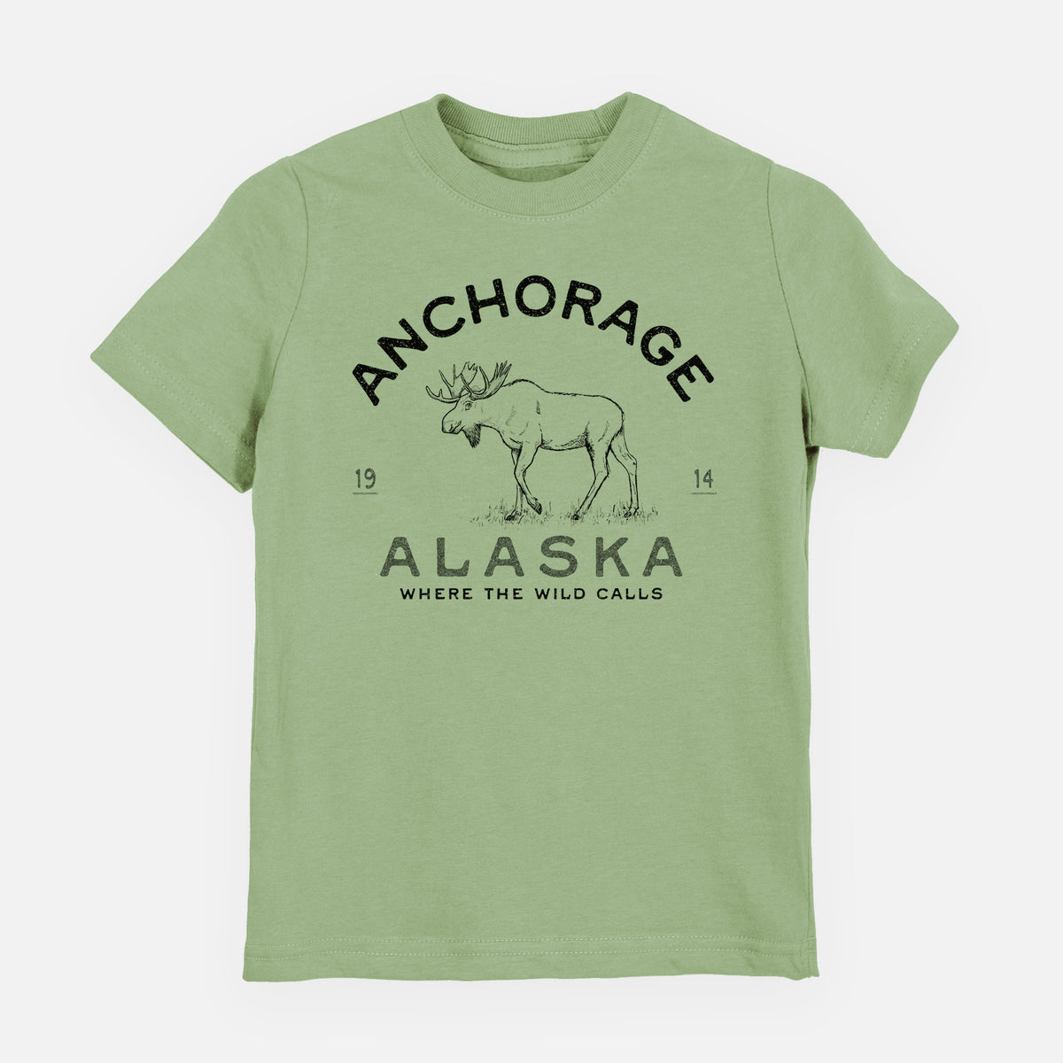 Sage green youth t-shirt laid flat, printed with a black ink moose with the words Anchorage Alaska, 1914, Where the Wild Calls.