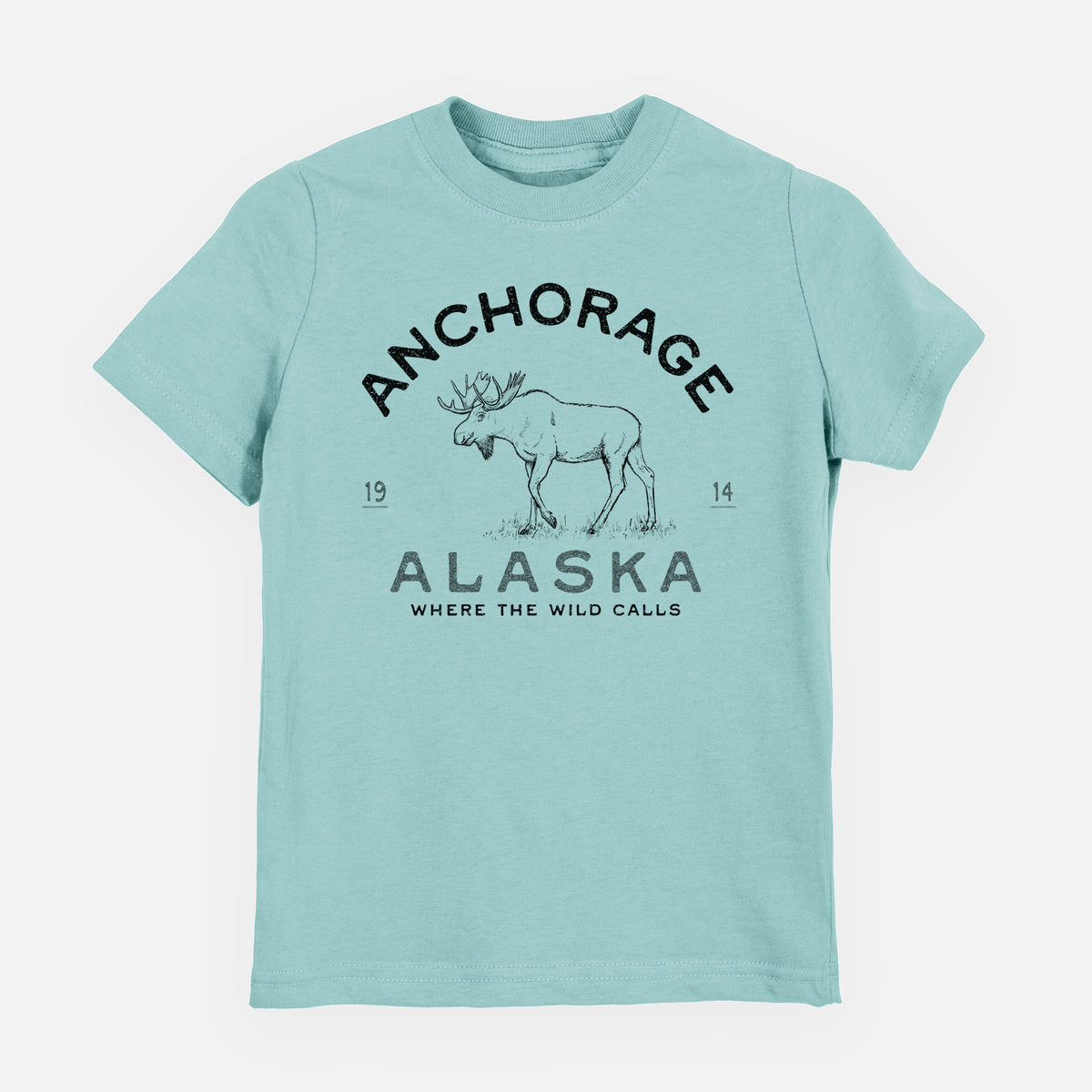 Saltwater youth t-shirt laid flat, printed with a black ink moose with the words Anchorage Alaska, 1914, Where the Wild Calls.
