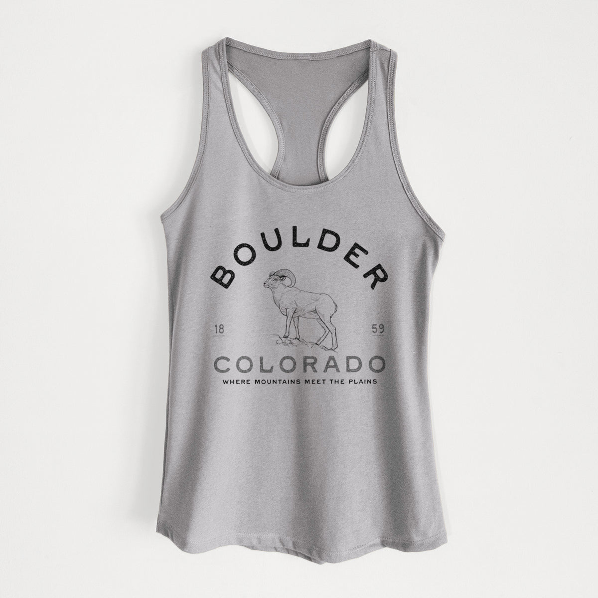 Heather grey women's racerback tank top laid flat, printed with a black ink bighorn sheep with the words Boulder Colorado, Where Mountains Meet the Plains, 1859.