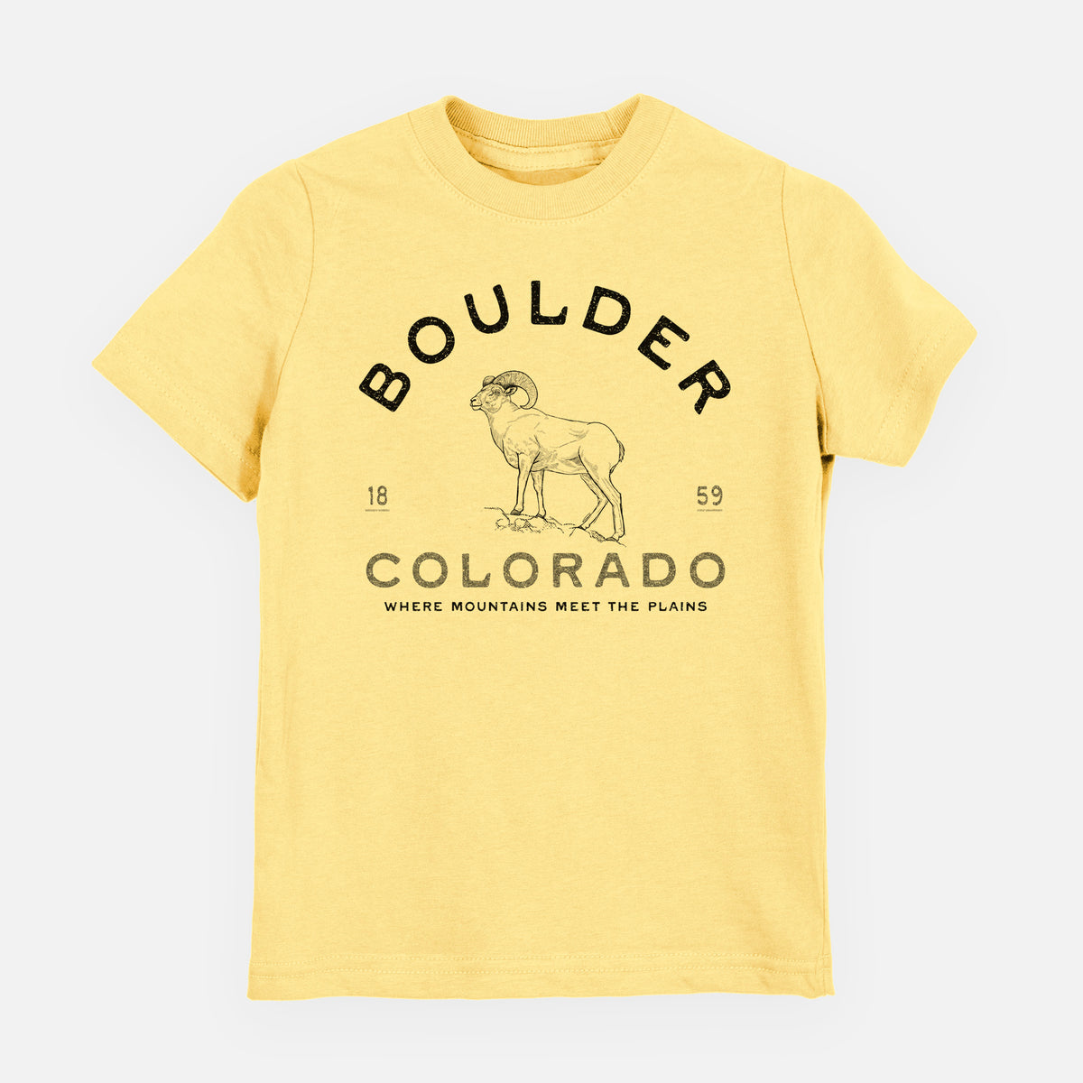 Butter yellow youth t-shirt laid flat, printed with a black ink bighorn sheep with the words Boulder Colorado, Where Mountains Meet the Plains, 1859.