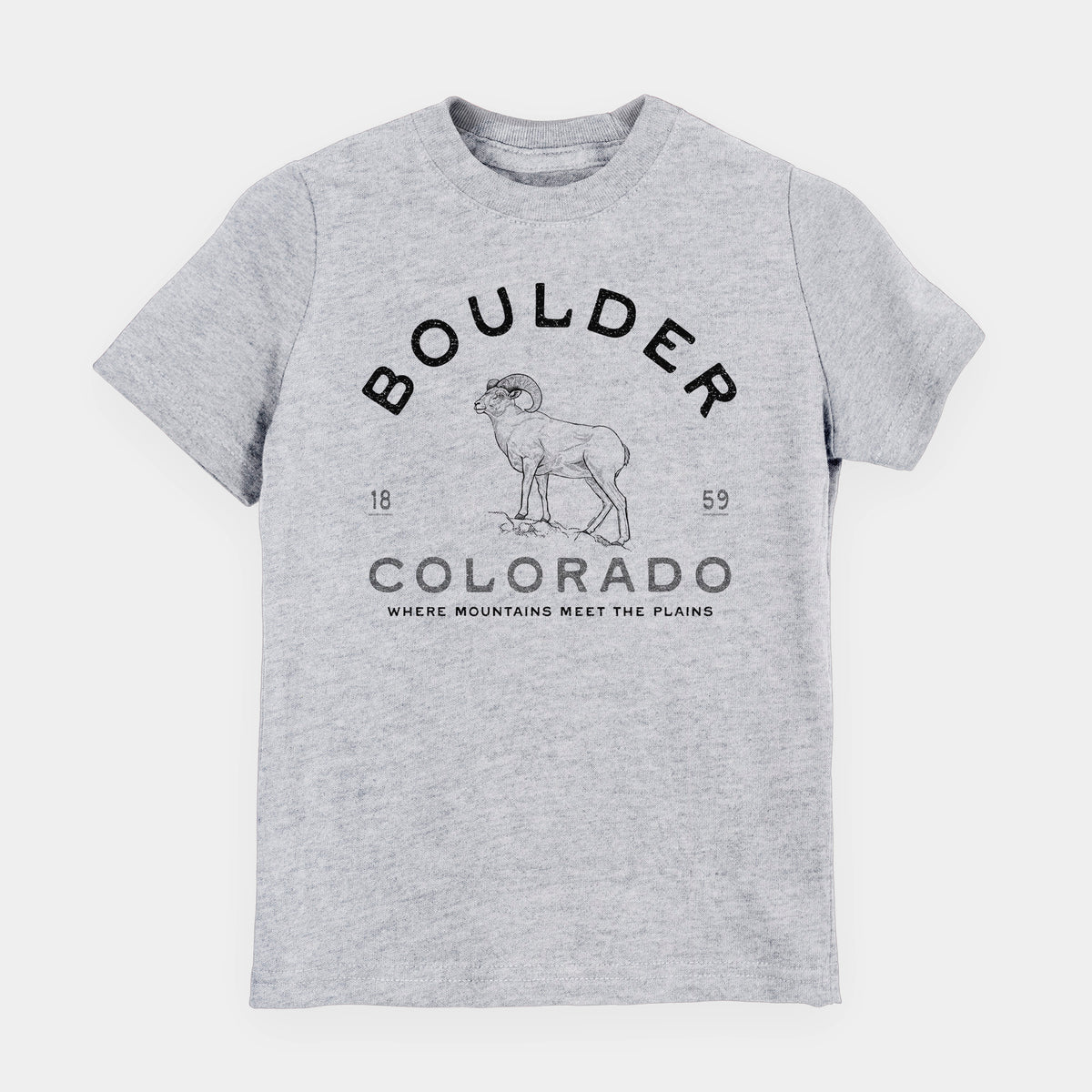 Heather grey youth t-shirt laid flat, printed with a black ink bighorn sheep with the words Boulder Colorado, Where Mountains Meet the Plains, 1859.