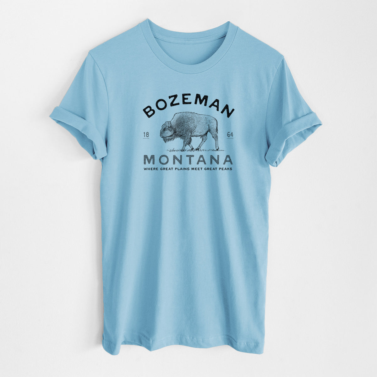 Ocean blue lightweight cotton t-shirt laid flat, printed with a black ink bison with the words Bozeman Montana, 1864, Where Great Plains Meet Great Peaks.