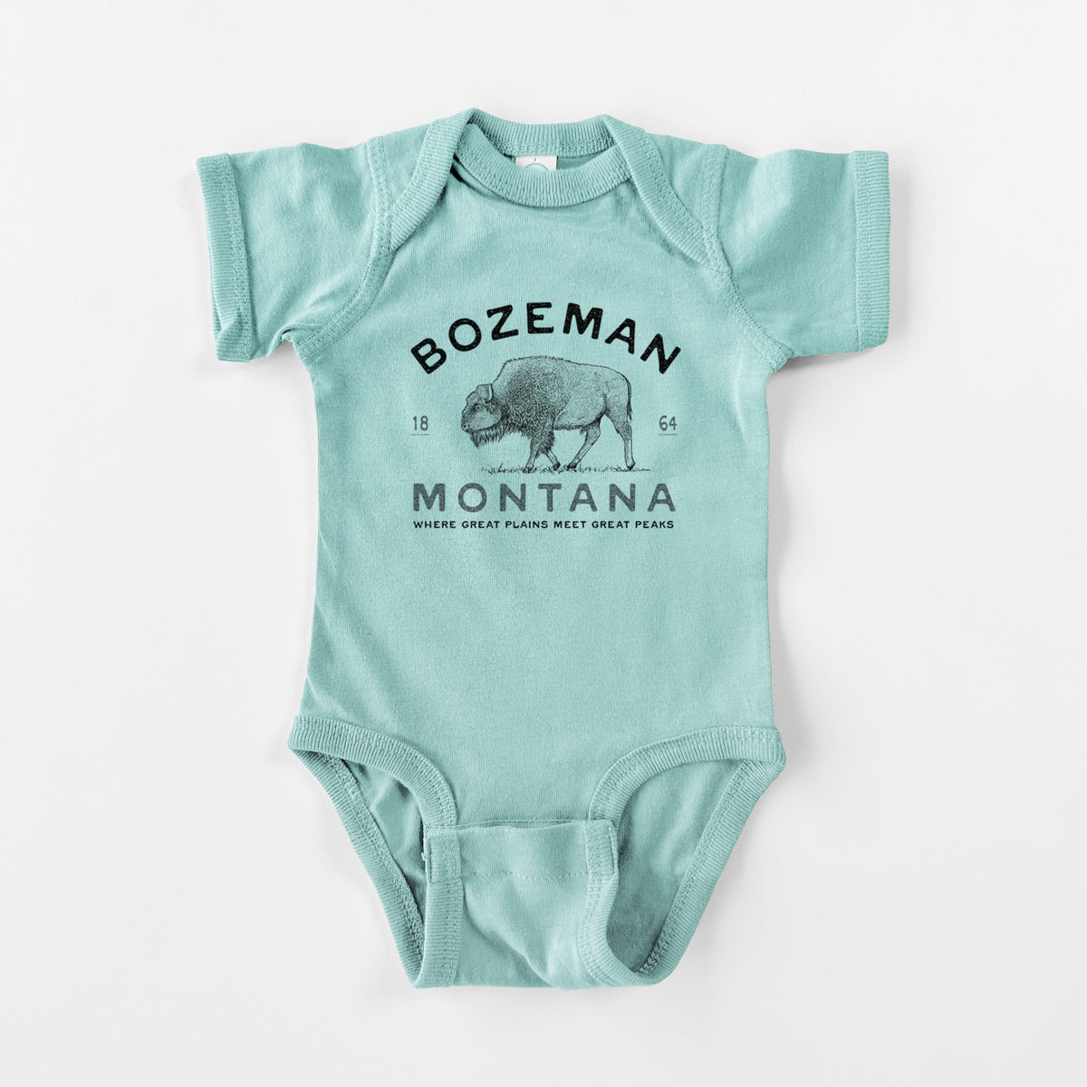 Saltwater baby bodysuit laid flat, printed with a black ink bison with the words Bozeman Montana, 1864, Where Great Plains Meet Great Peaks.