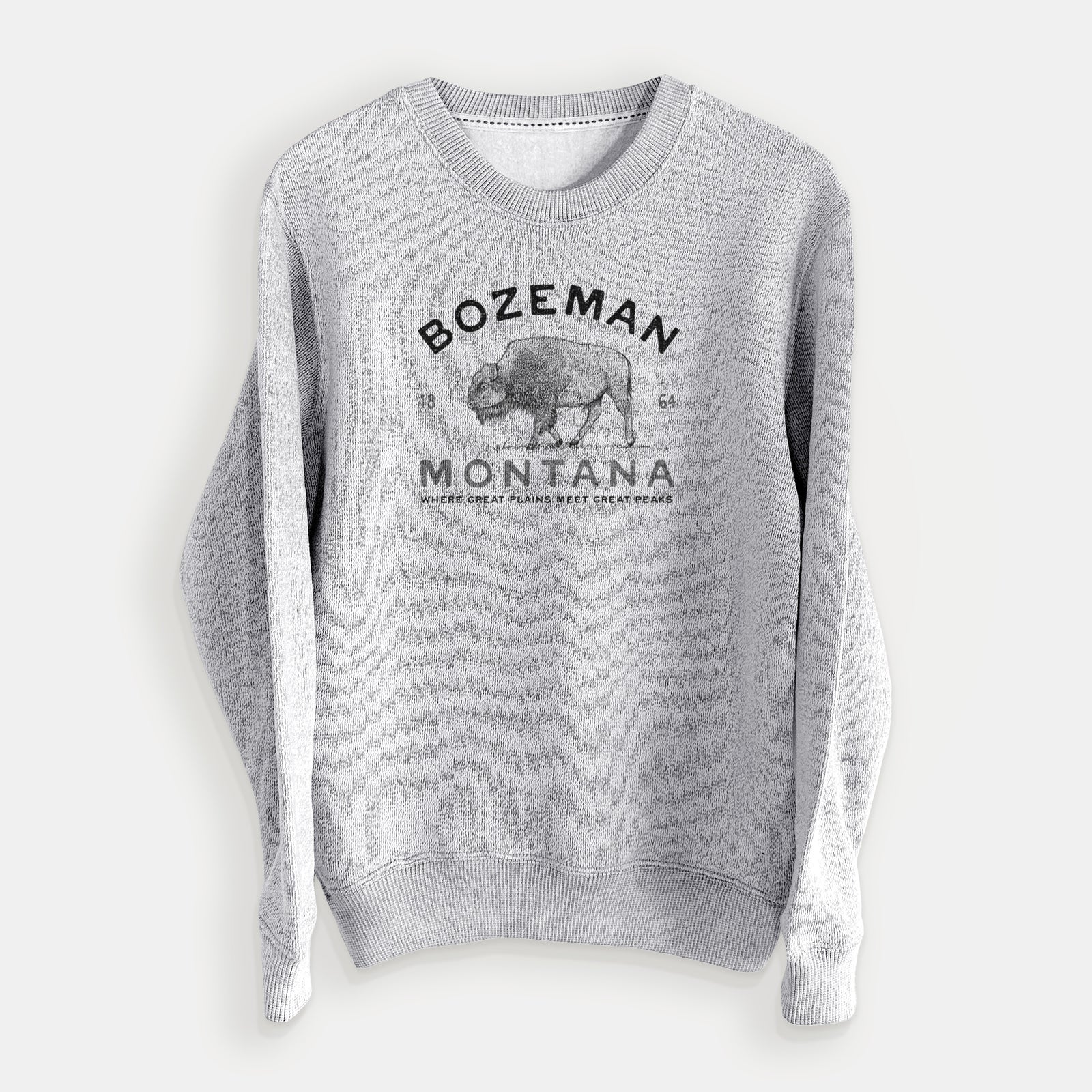 Salt and pepper knit sweatshirt laid flat, printed with a black ink bison with the words Bozeman Montana, 1864, Where Great Plains Meet Great Peaks.