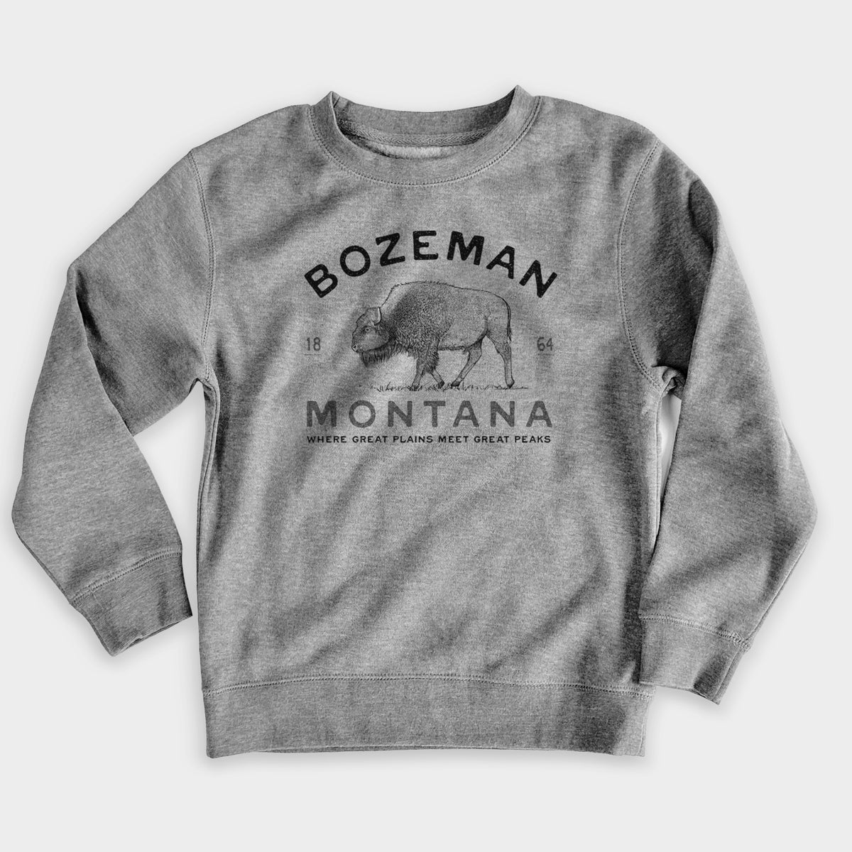 Nickel grey youth crewneck sweatshirt laid flat, printed with a black ink bison with the words Bozeman Montana, 1864, Where Great Plains Meet Great Peaks.