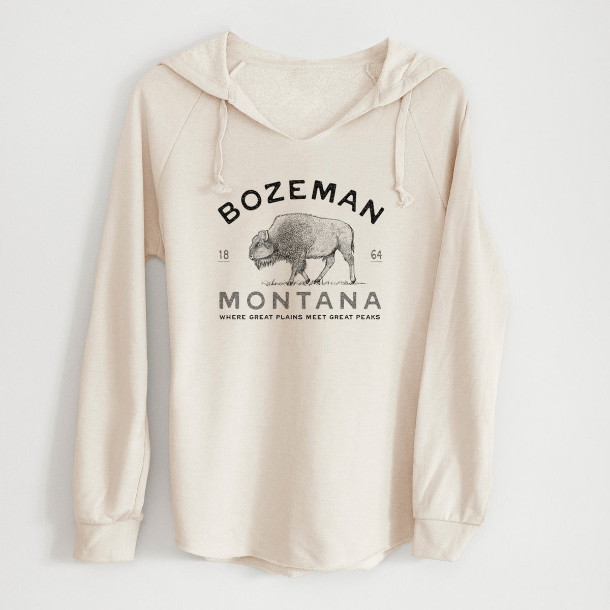 Bone cream women's Cali Wave hooded sweatshirt laid flat, printed with a black ink bison with the words Bozeman Montana, 1864, Where Great Plains Meet Great Peaks.