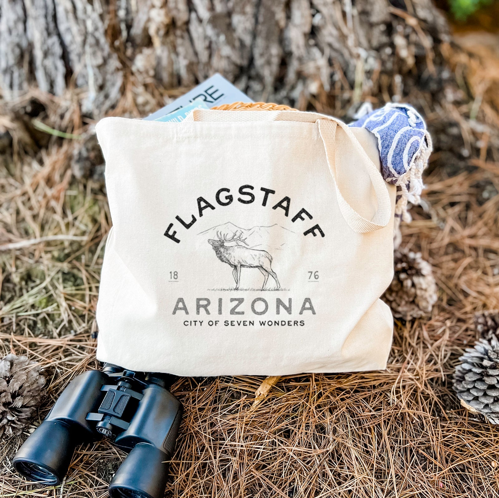 Natural canvas tote bag printed with a black ink elk with the words Flagstaff Arizona, City of Seven Wonders.