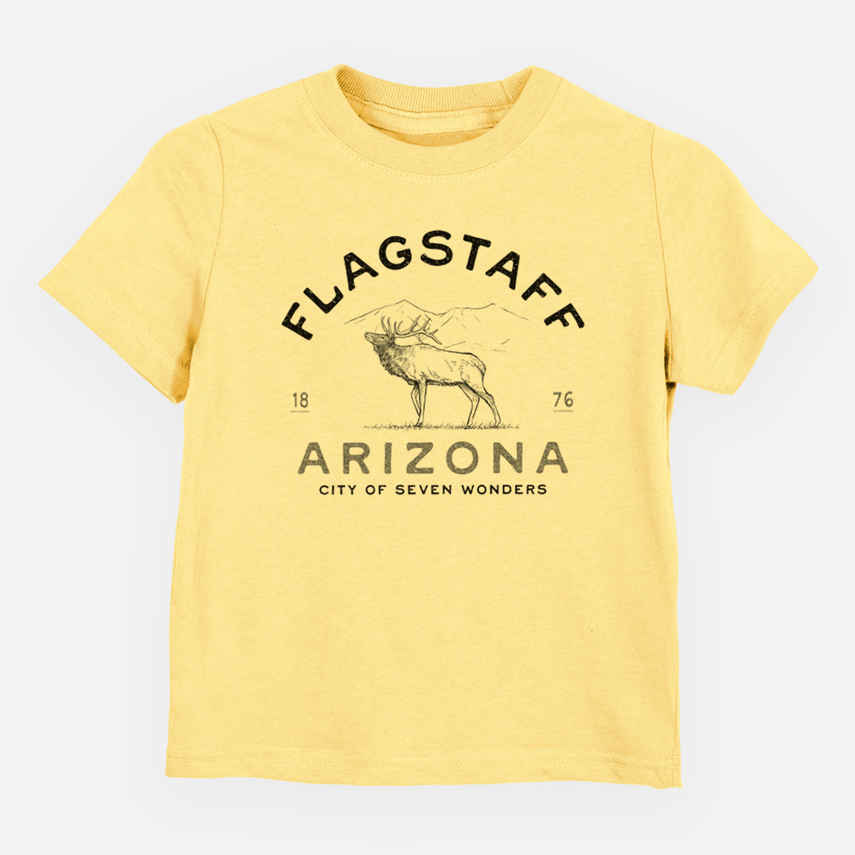 Butter yellow toddler t-shirt laid flat, printed with a black ink elk with the words Flagstaff Arizona, City of Seven Wonders.
