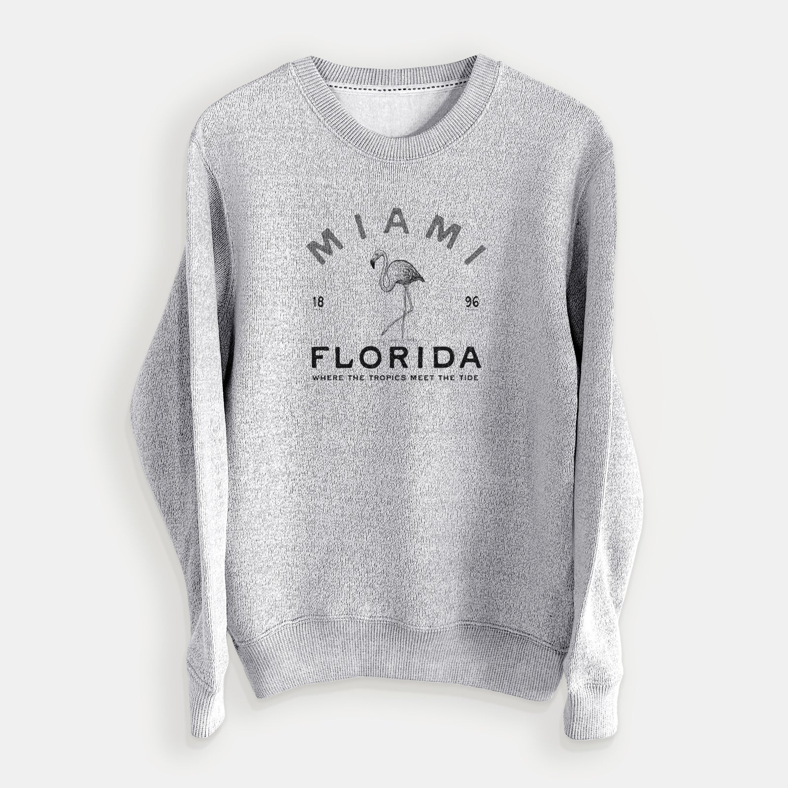 Salt and pepper knit sweatshirt laid flat, printed with a black ink flamingo with the words Miami Florida, 1896, Where the Tropics Meet the Tide.