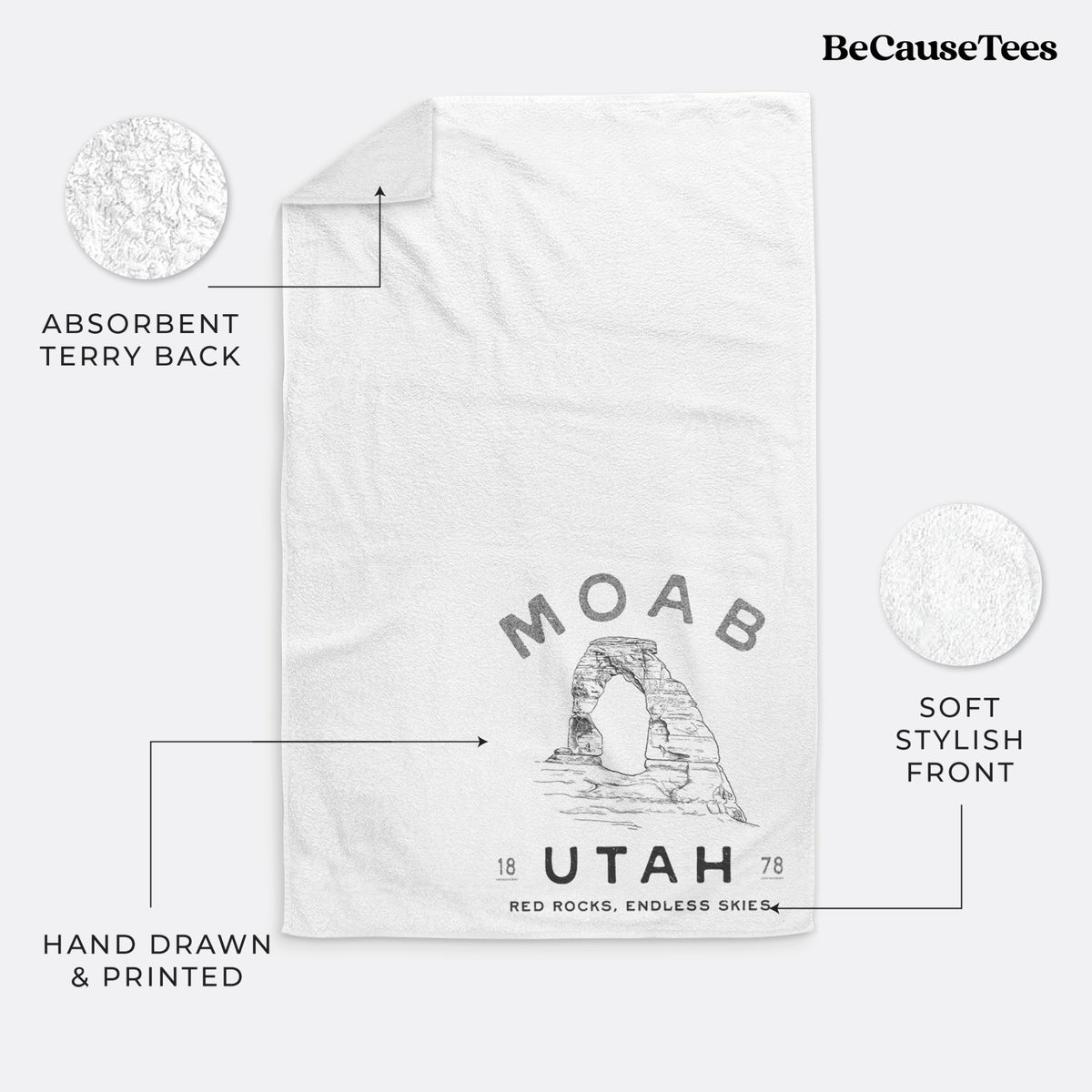 White hand towel printed with a black ink illustration of Delicate Arch with the words Moab Utah, 1878.