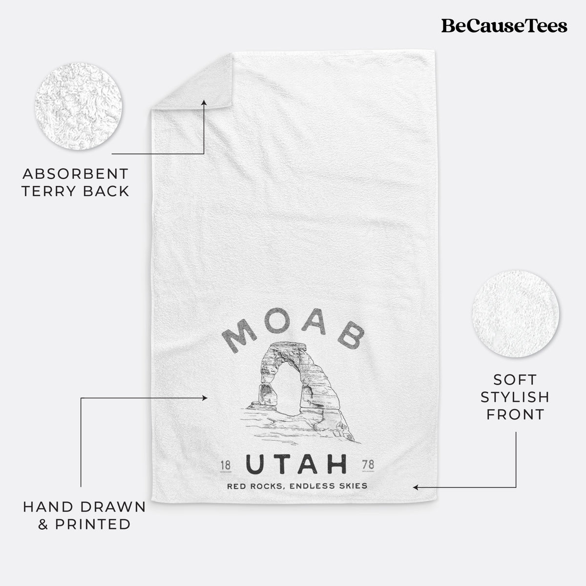 White hand towel printed with a black ink illustration of Delicate Arch with the words Moab Utah, 1878.