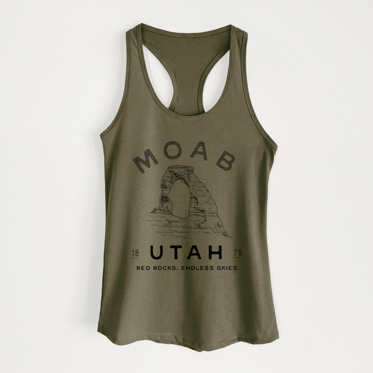 Military green women's racerback tank top laid flat, printed with a black ink illustration of Delicate Arch with the words Moab Utah, 1878.