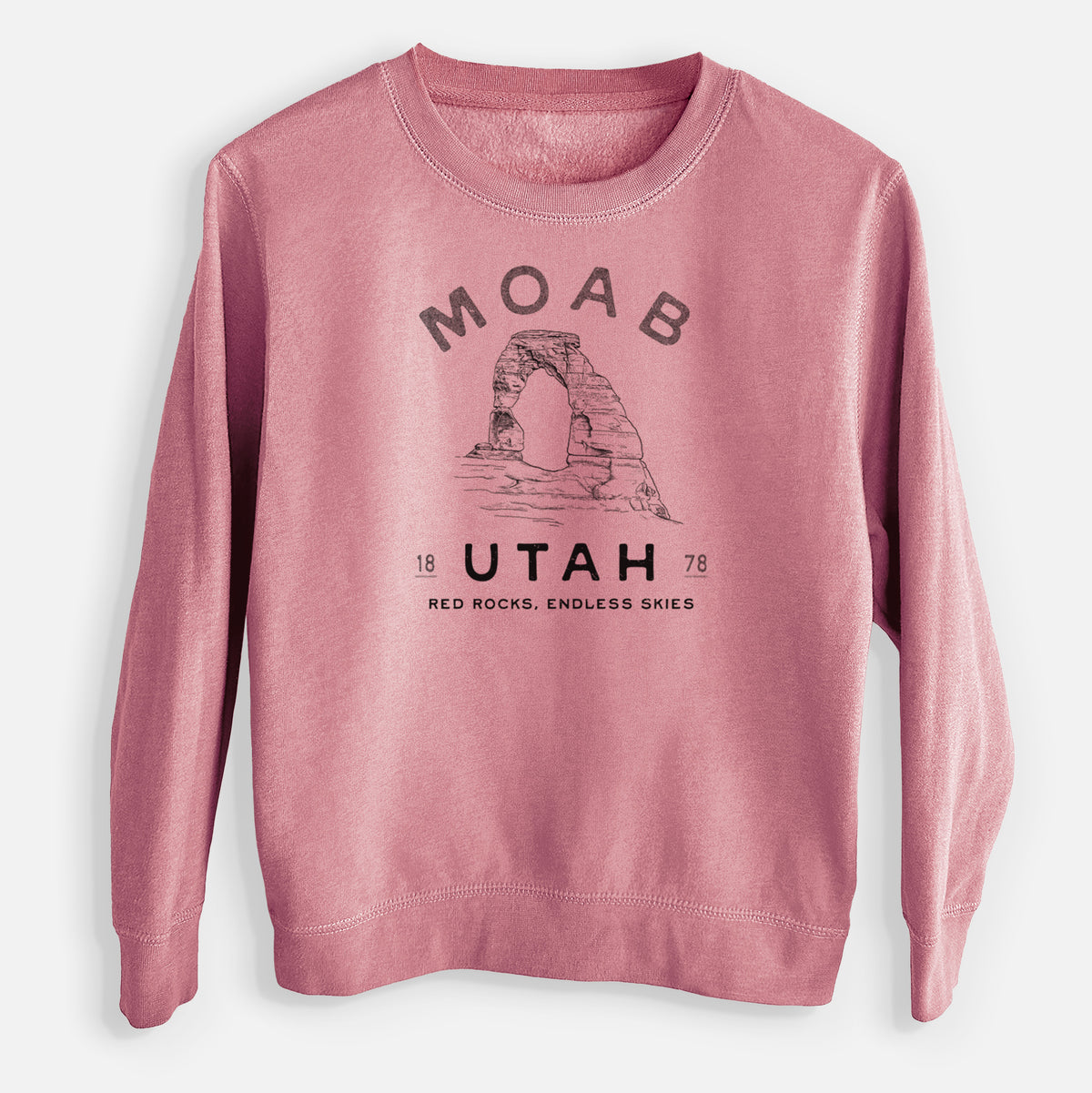 Mauve pink youth crewneck sweatshirt laid flat, printed with a black ink illustration of Delicate Arch with the words Moab Utah, 1878.