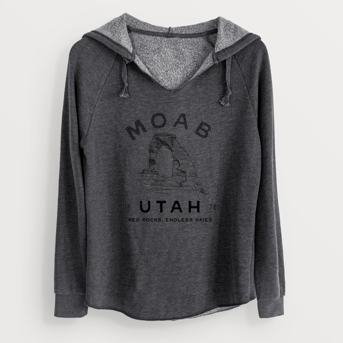 Charcoal grey women's Cali Wave hooded sweatshirt laid flat, printed with a black ink illustration of Delicate Arch with the words Moab Utah, 1878.