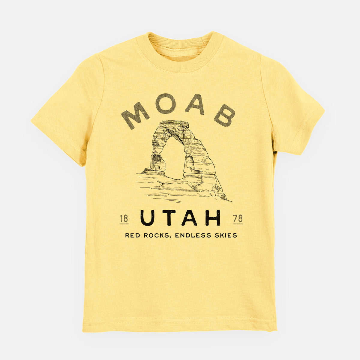 Butter yellow youth t-shirt laid flat, printed with a black ink illustration of Delicate Arch with the words Moab Utah, 1878.