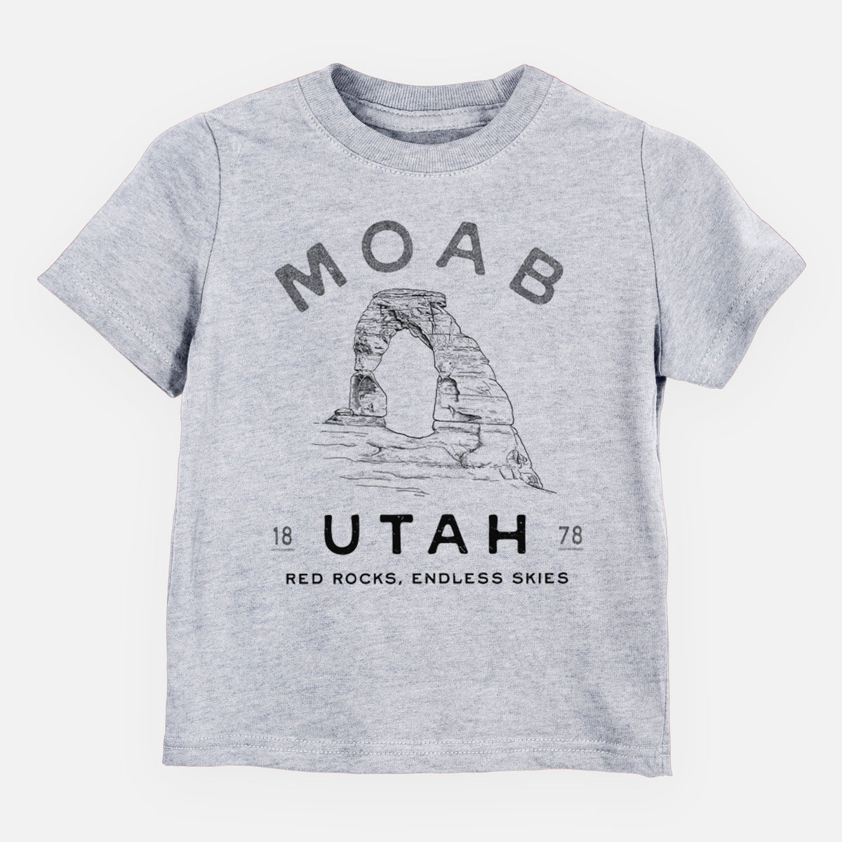 Heather grey toddler t-shirt laid flat, printed with a black ink illustration of Delicate Arch with the words Moab Utah, 1878.
