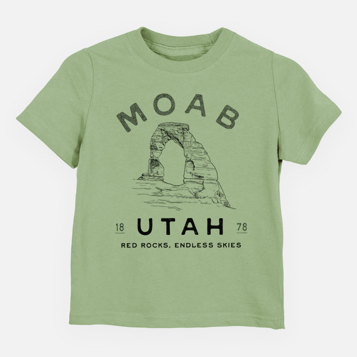 Sage green toddler t-shirt laid flat, printed with a black ink illustration of Delicate Arch with the words Moab Utah, 1878.