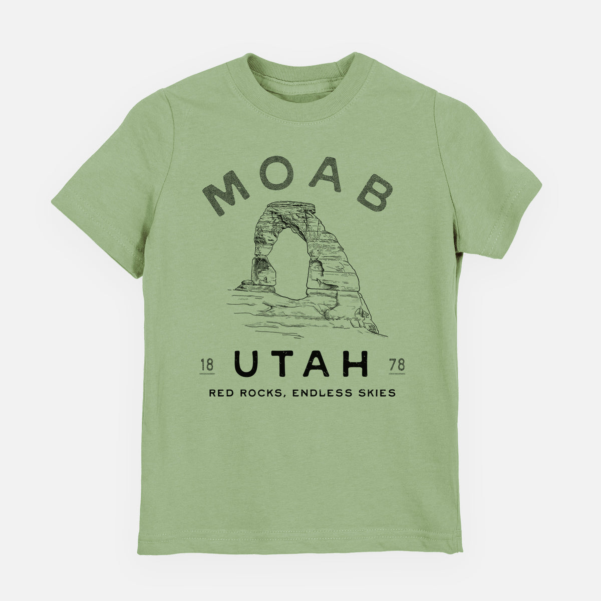 Sage green youth t-shirt laid flat, printed with a black ink illustration of Delicate Arch with the words Moab Utah, 1878.