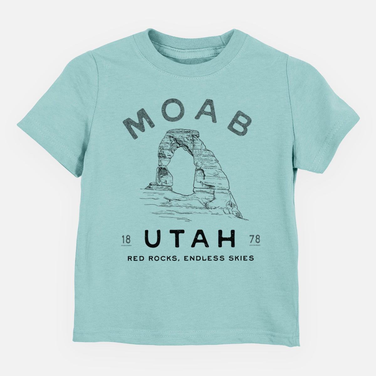 Saltwater toddler t-shirt laid flat, printed with a black ink illustration of Delicate Arch with the words Moab Utah, 1878.