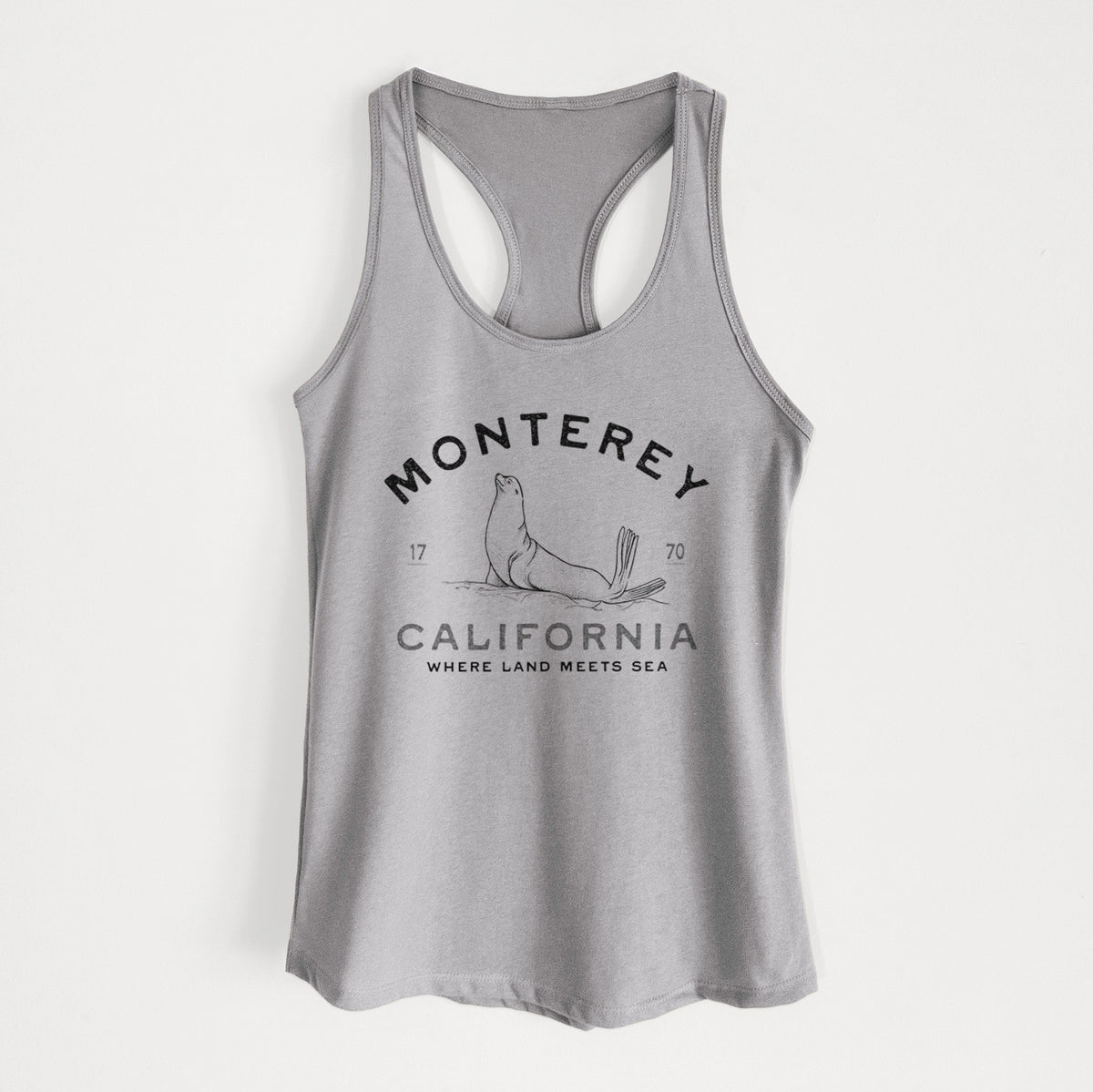 Heather grey women's racerback tank top laid flat, printed with a black ink sea lion with the words Monterey California, 1770, Where Land Meets Sea.