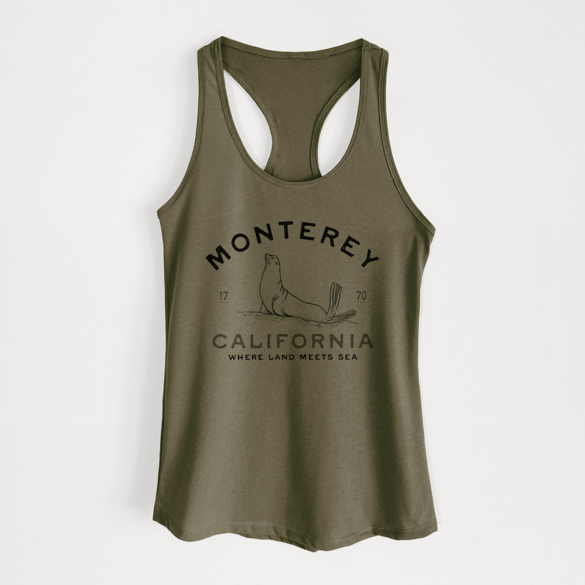 Military green women's racerback tank top laid flat, printed with a black ink sea lion with the words Monterey California, 1770, Where Land Meets Sea.