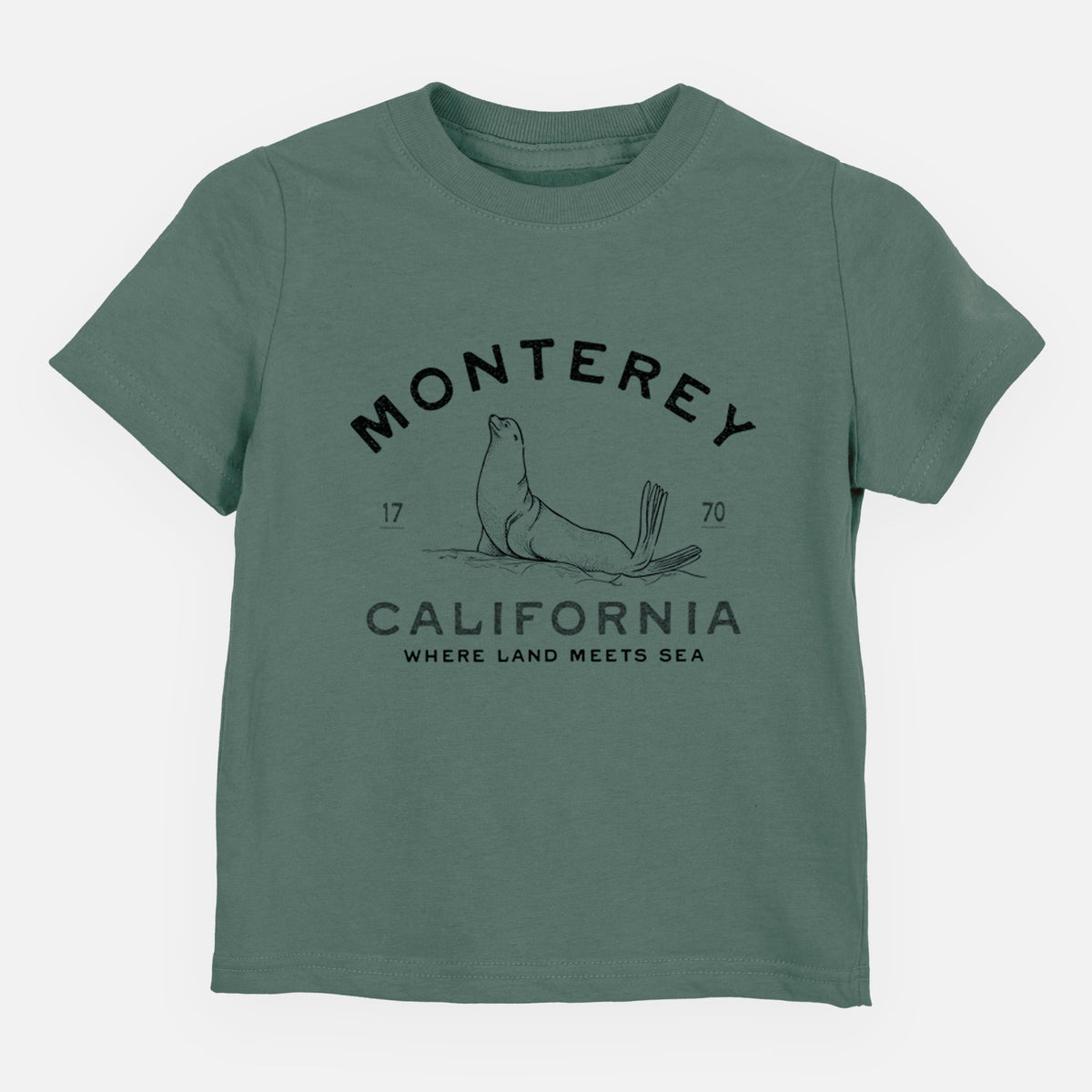 Basil green toddler t-shirt laid flat, printed with a black ink sea lion with the words Monterey California, 1770, Where Land Meets Sea.