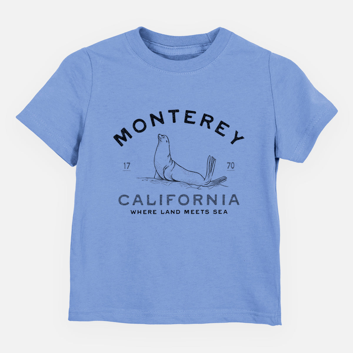 Carolina blue toddler t-shirt laid flat, printed with a black ink sea lion with the words Monterey California, 1770, Where Land Meets Sea.
