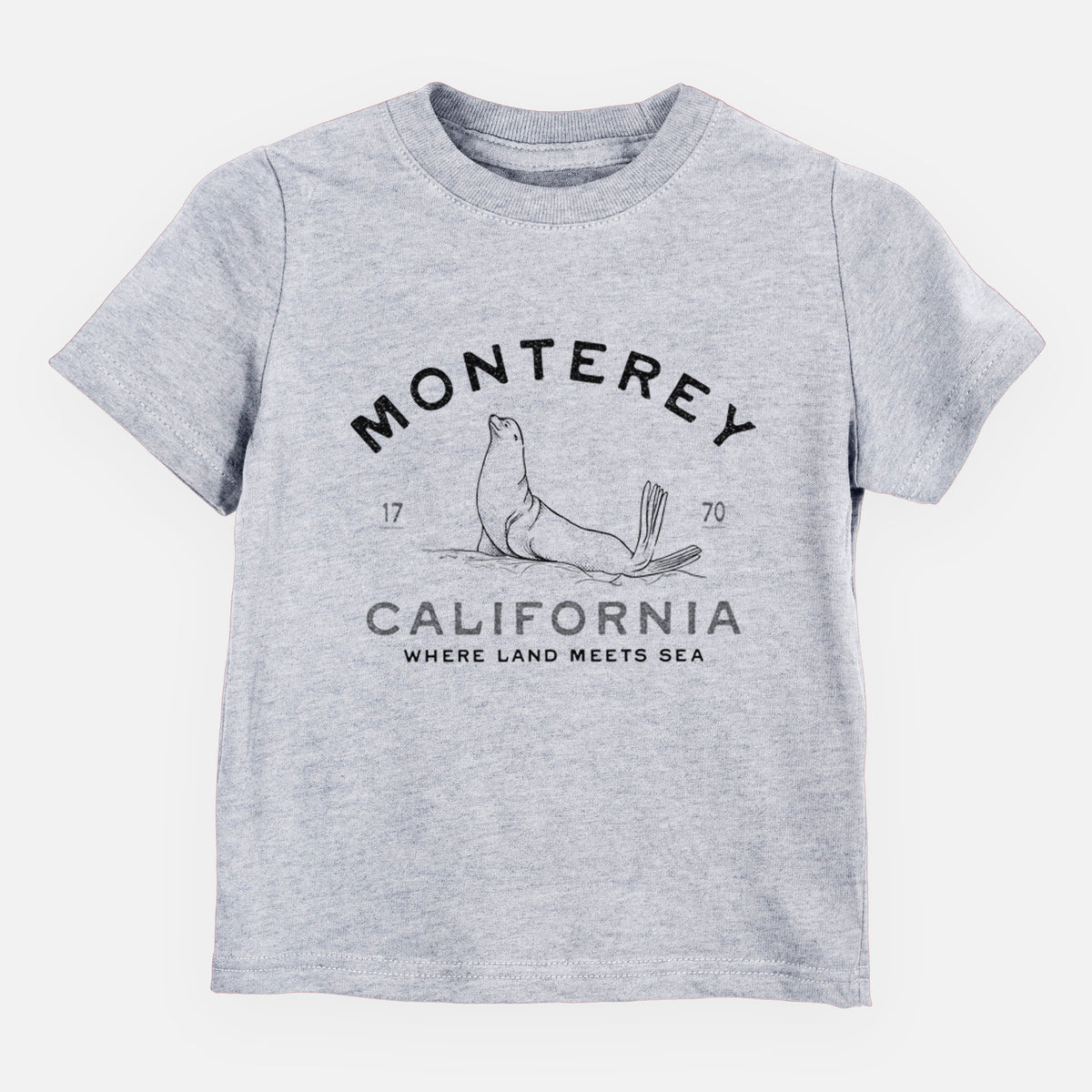Heather grey toddler t-shirt laid flat, printed with a black ink sea lion with the words Monterey California, 1770, Where Land Meets Sea.