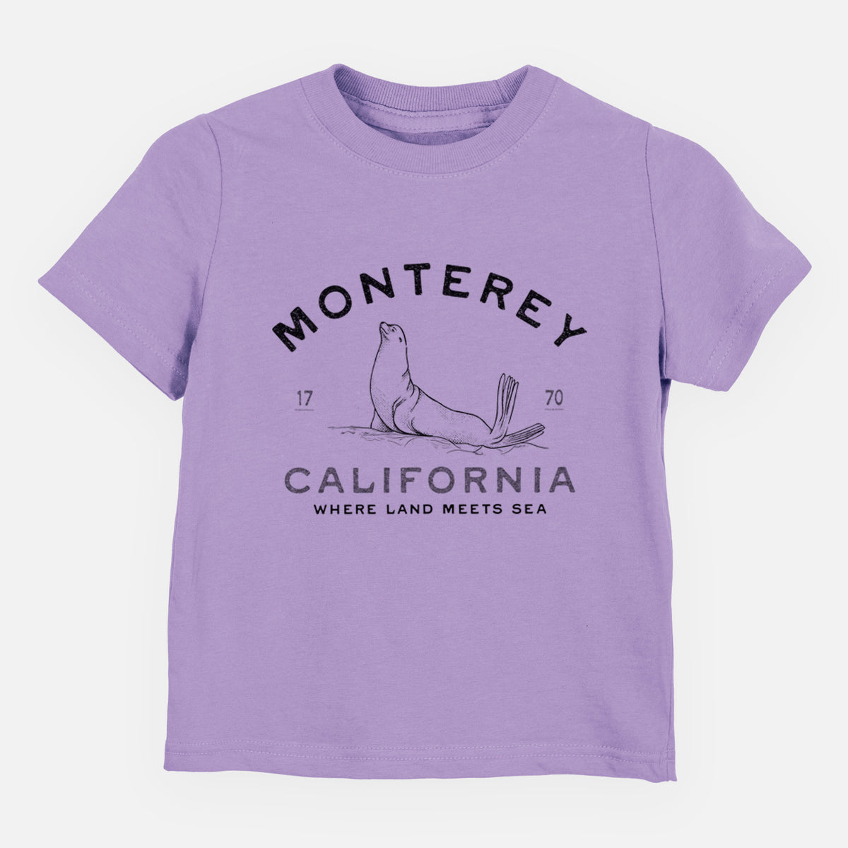 Lavender toddler t-shirt laid flat, printed with a black ink sea lion with the words Monterey California, 1770, Where Land Meets Sea.