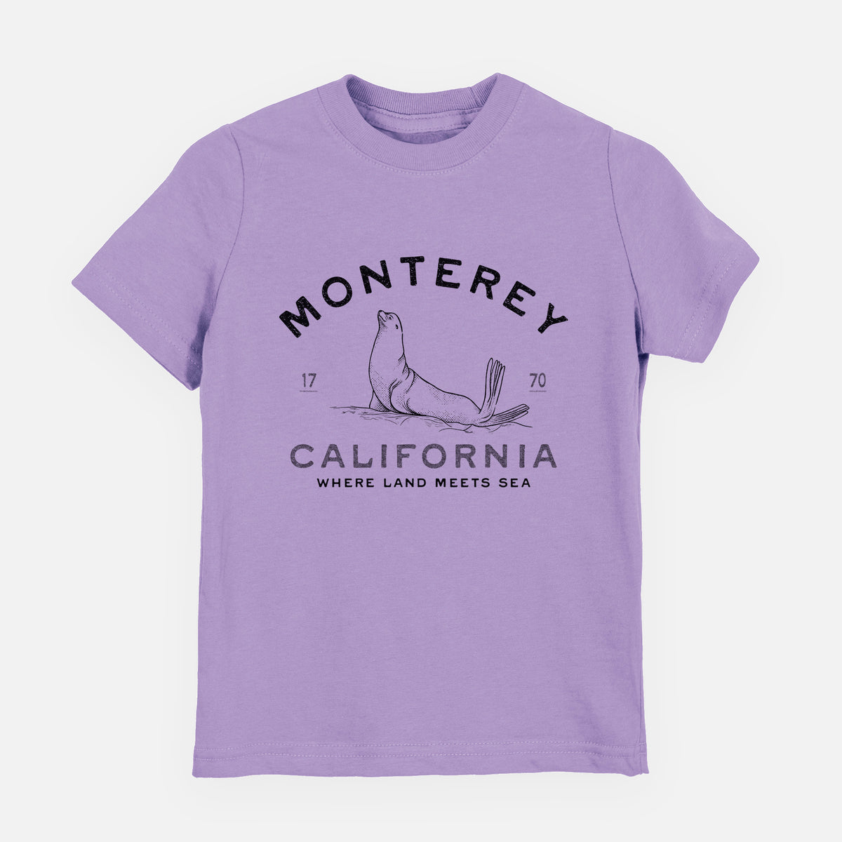 Lavender youth t-shirt laid flat, printed with a black ink sea lion with the words Monterey California, 1770, Where Land Meets Sea.
