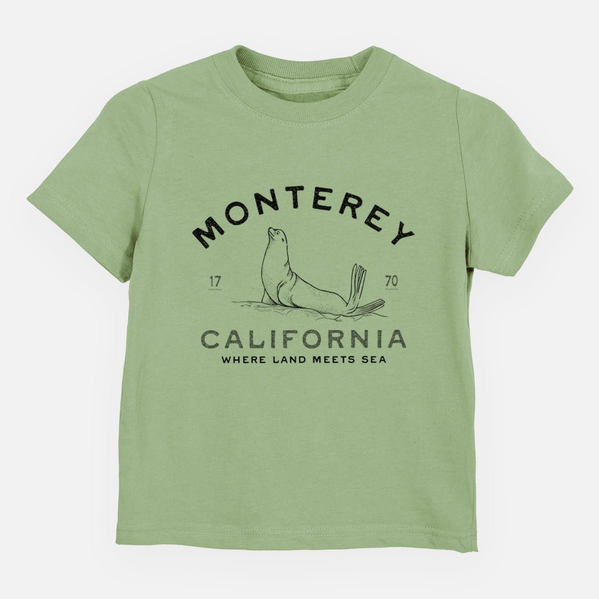 Sage green toddler t-shirt laid flat, printed with a black ink sea lion with the words Monterey California, 1770, Where Land Meets Sea.