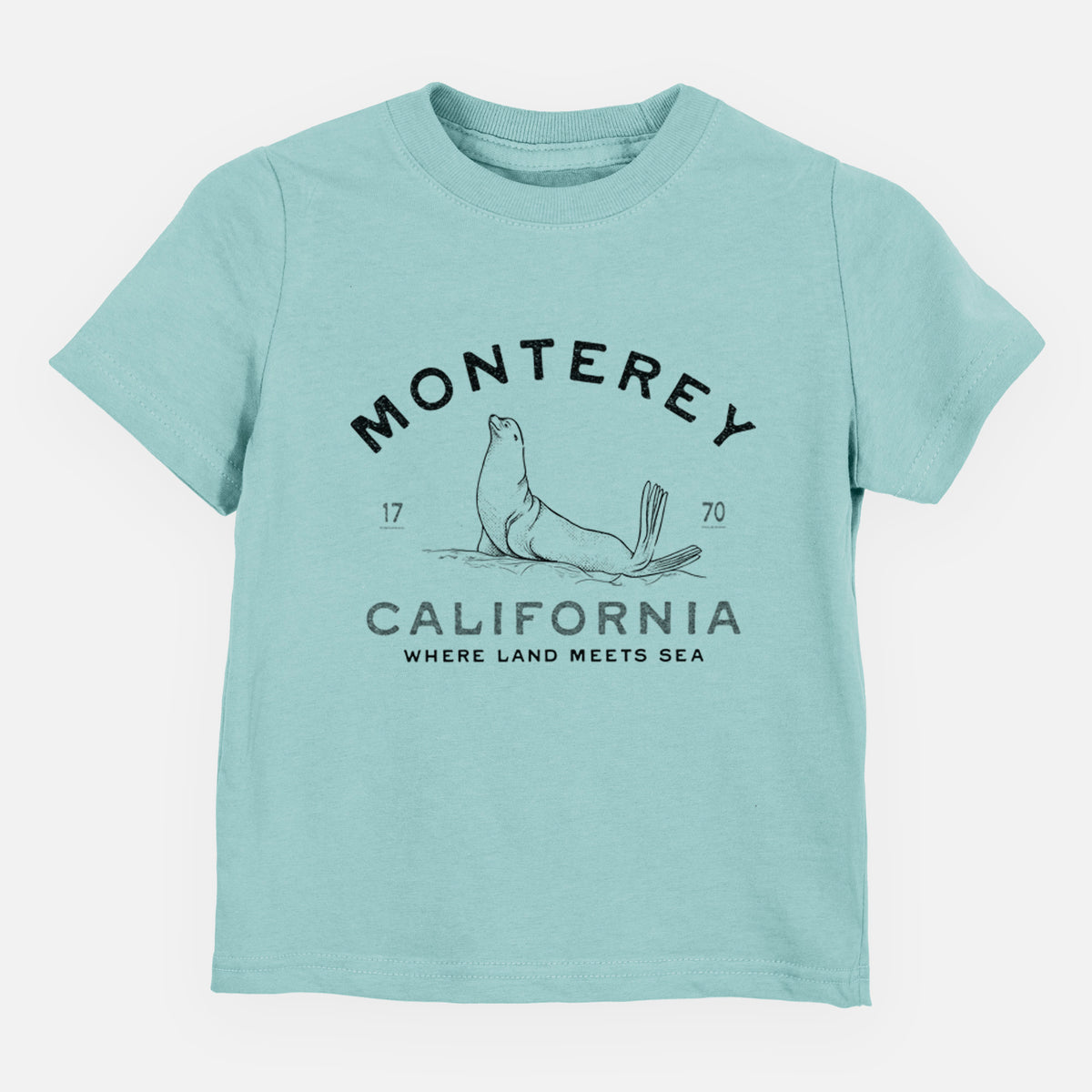 Saltwater toddler t-shirt laid flat, printed with a black ink sea lion with the words Monterey California, 1770, Where Land Meets Sea.