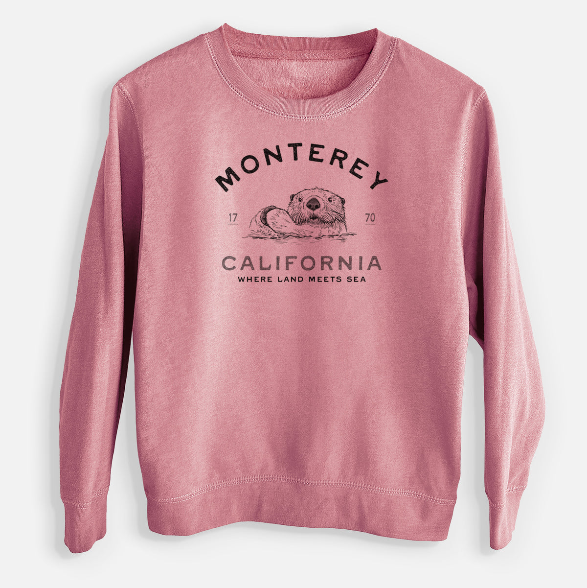 Mauve pink youth crewneck sweatshirt laid flat, printed with a black ink sea otter floating on its back, with the words Monterey California, 1770, Where Land Meets Sea.