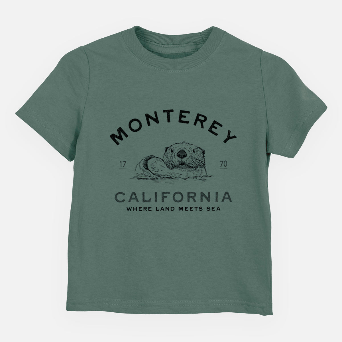 Basil green toddler t-shirt laid flat, printed with a black ink sea otter floating on its back, with the words Monterey California, 1770, Where Land Meets Sea.