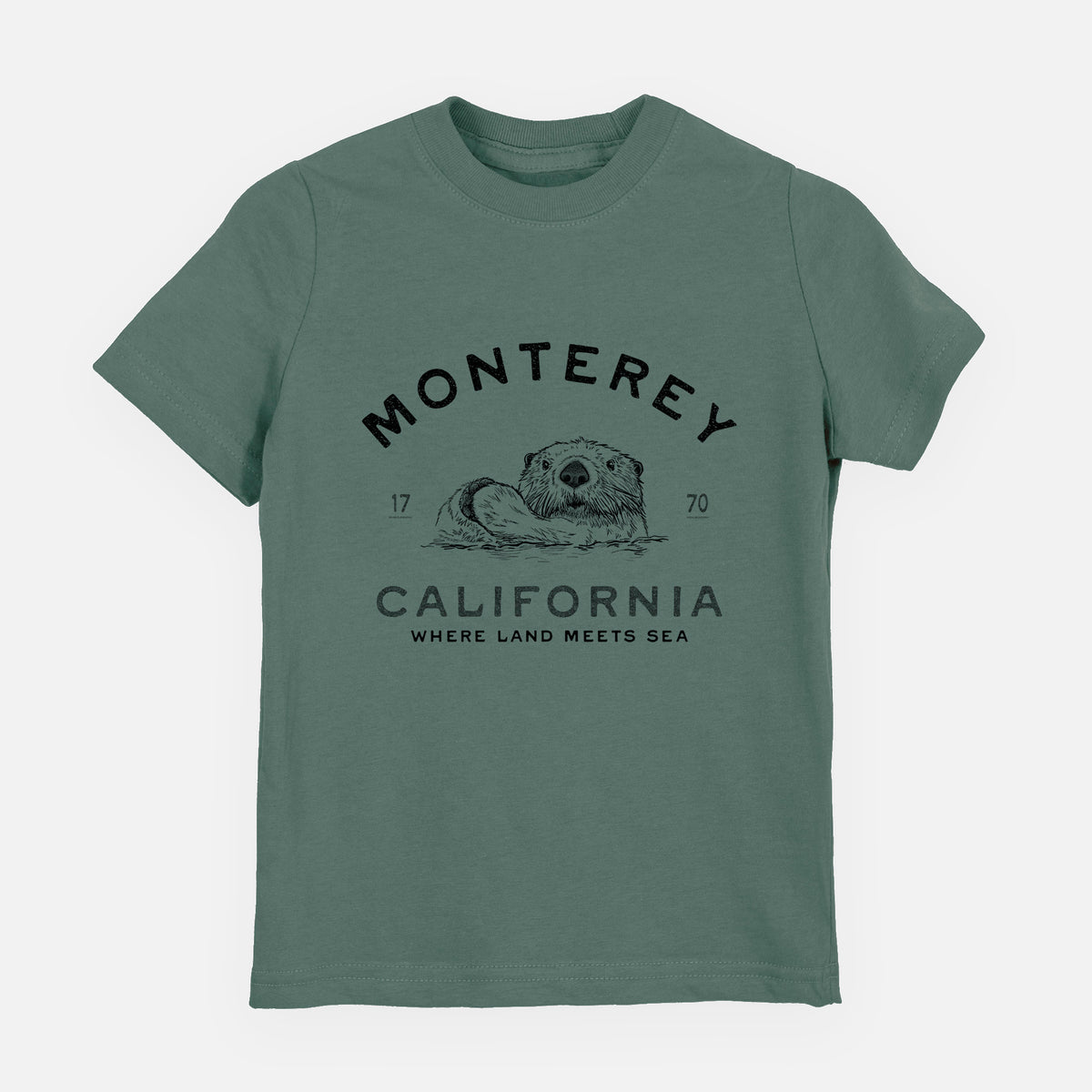 Basil green youth t-shirt laid flat, printed with a black ink sea otter floating on its back, with the words Monterey California, 1770, Where Land Meets Sea.