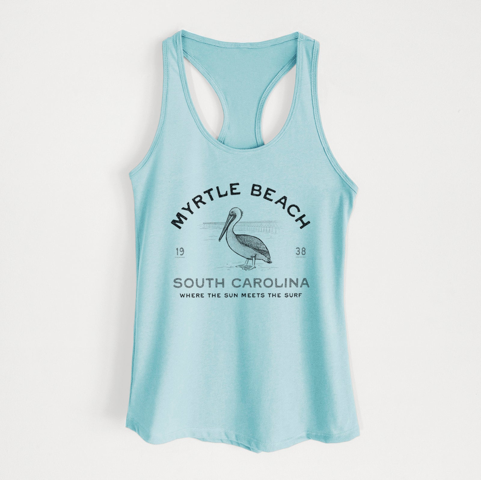 Banana cream women's racerback tank top laid flat, printed with a black ink pelican on a post with the words Myrtle Beach South Carolina, Where the Sun Meets the Surf.