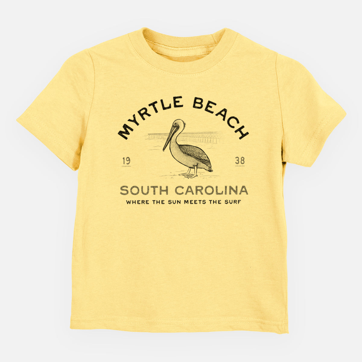 Butter yellow toddler t-shirt laid flat, printed with a black ink pelican on a post with the words Myrtle Beach South Carolina, Where the Sun Meets the Surf.