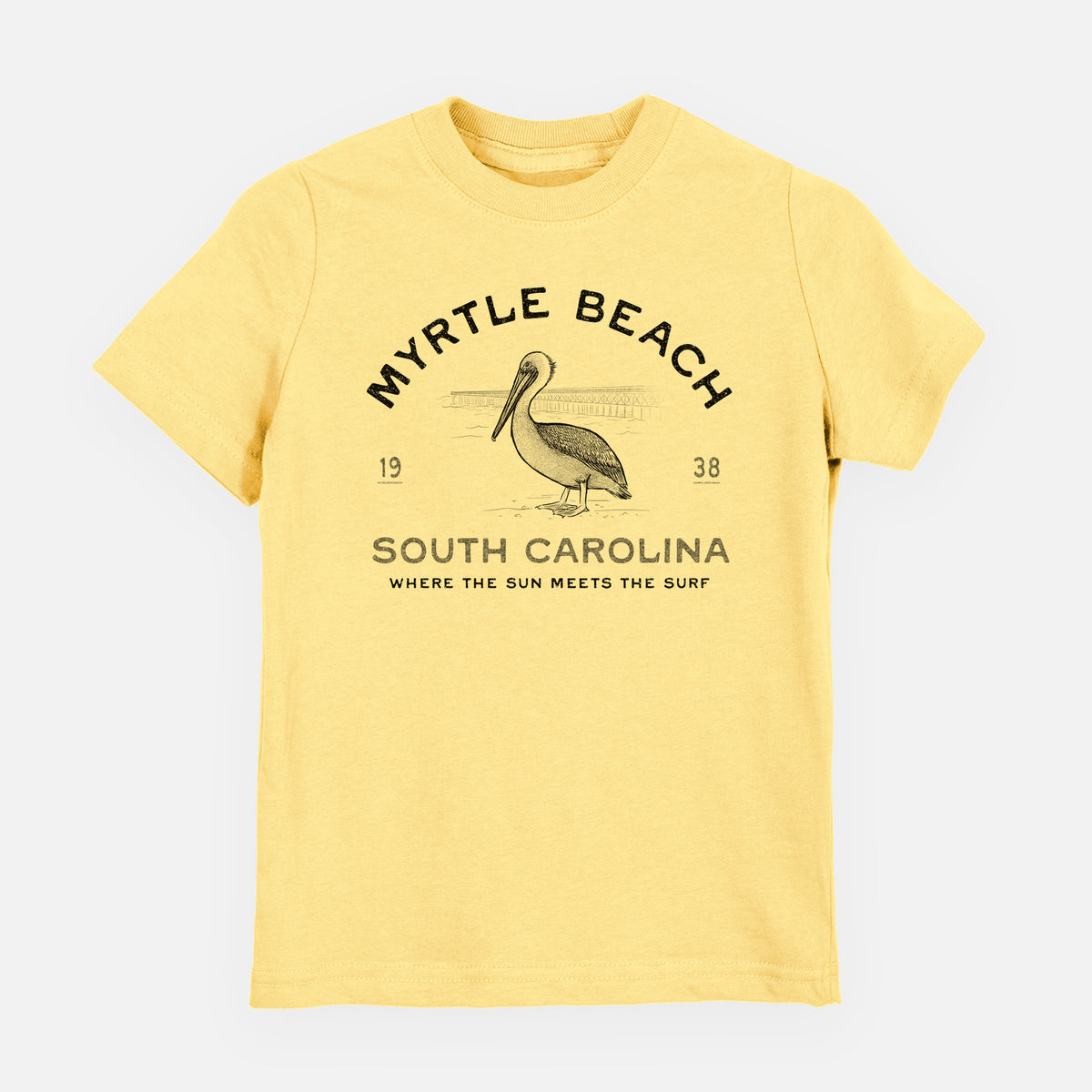 Butter yellow youth t-shirt laid flat, printed with a black ink pelican on a post with the words Myrtle Beach South Carolina, Where the Sun Meets the Surf.