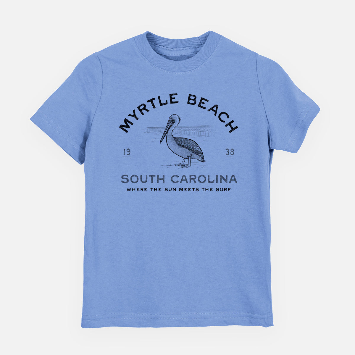 Carolina blue youth t-shirt laid flat, printed with a black ink pelican on a post with the words Myrtle Beach South Carolina, Where the Sun Meets the Surf.