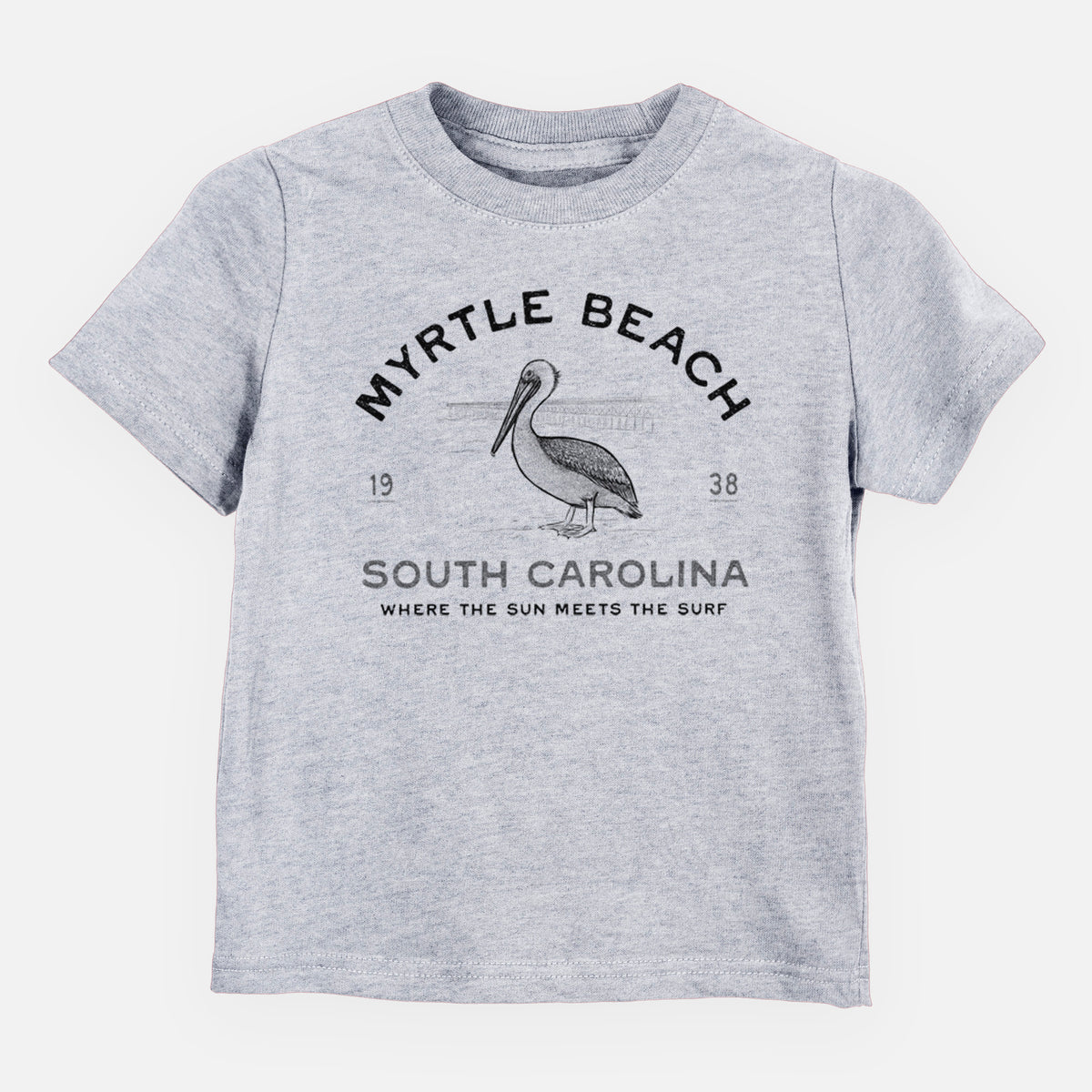 Heather grey toddler t-shirt laid flat, printed with a black ink pelican on a post with the words Myrtle Beach South Carolina, Where the Sun Meets the Surf.