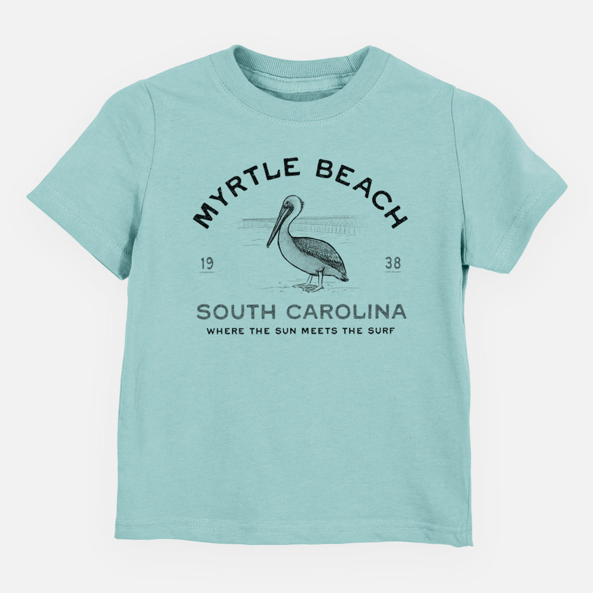Saltwater toddler t-shirt laid flat, printed with a black ink pelican on a post with the words Myrtle Beach South Carolina, Where the Sun Meets the Surf.