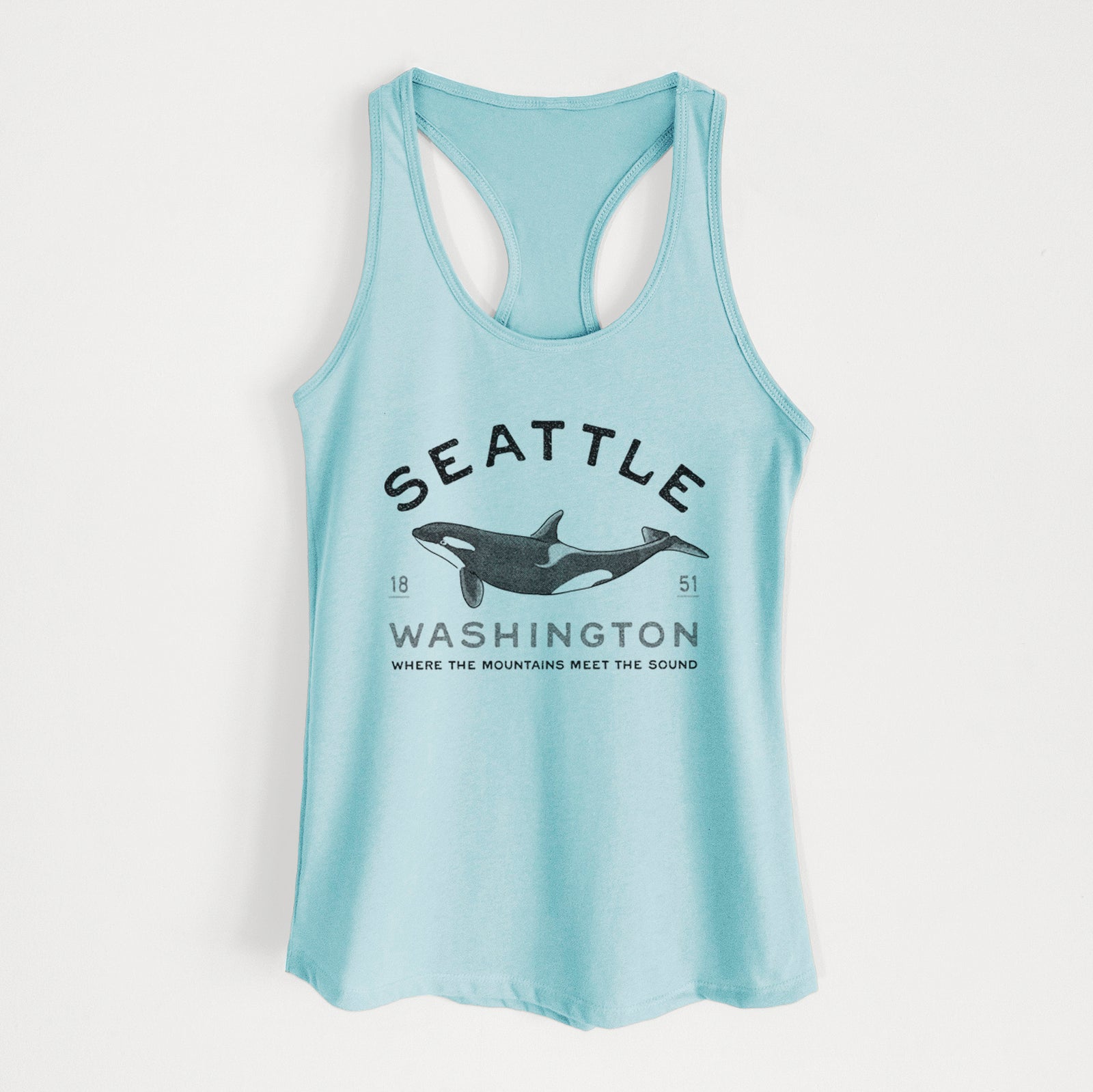 Banana cream women's racerback tank top laid flat, printed with a black ink orca with the words Seattle Washington, 1851, Where the Mountains Meet the Sound.